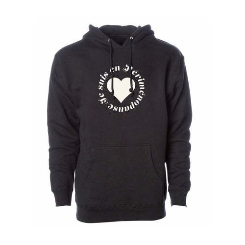 A black pullover hoodie with a white circular graphic on the chest featuring a heart and the text 'JE SUIS EN PÉRIMÉNOPAUSE', shown against a plain white background.