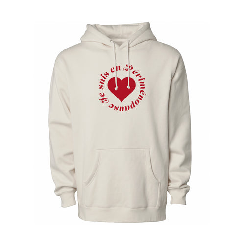 An off-white hooded sweatshirt with a red graphic on the chest featuring a heart and the French text 'JE SUIS EN PÉRIMÉNOPAUSE', displayed against a plain white background.