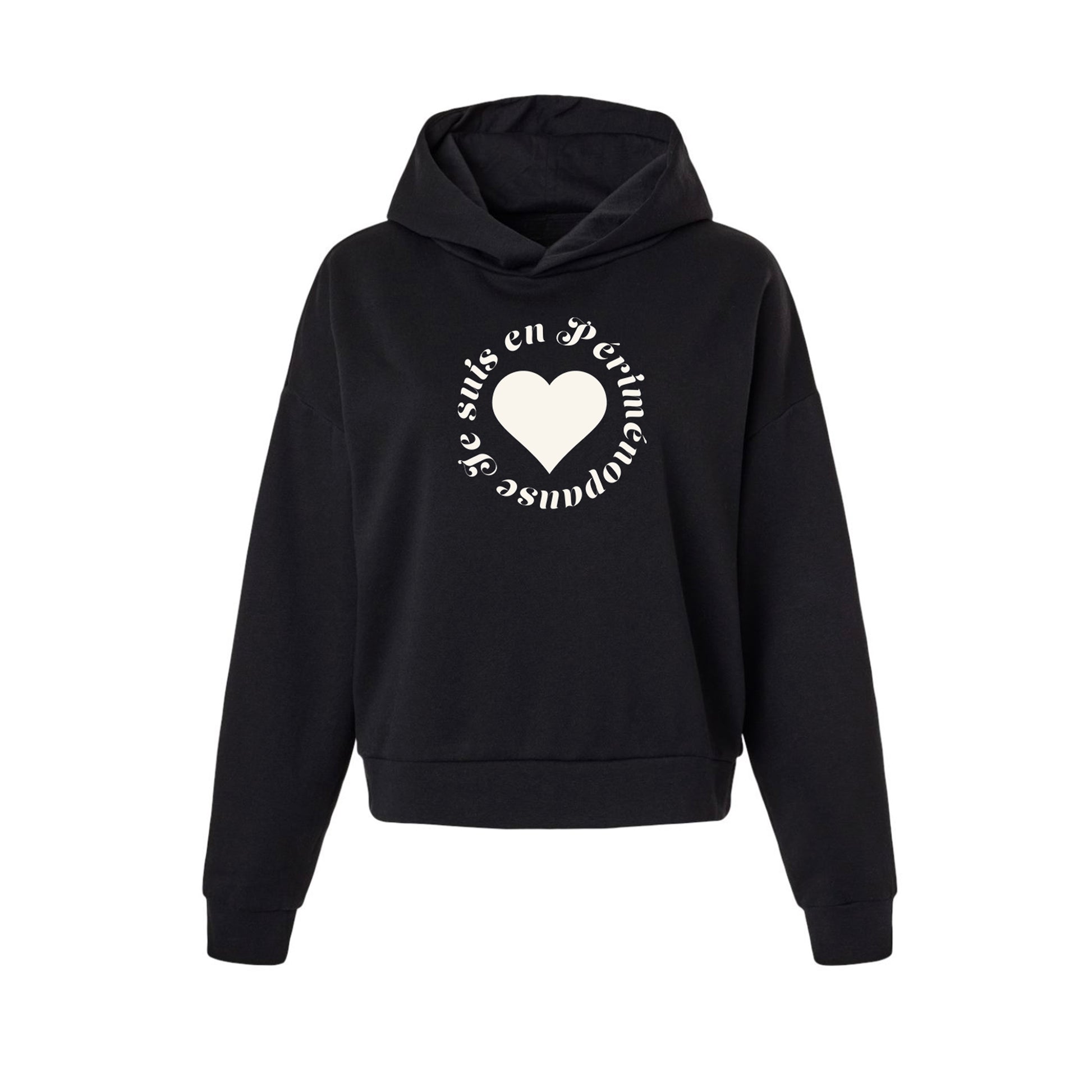 A black cropped pullover hoodie with a white graphic on the chest featuring a heart and circular text JE SUIS EN PÉRIMÉNOPAUSE, displayed on a solid white background.